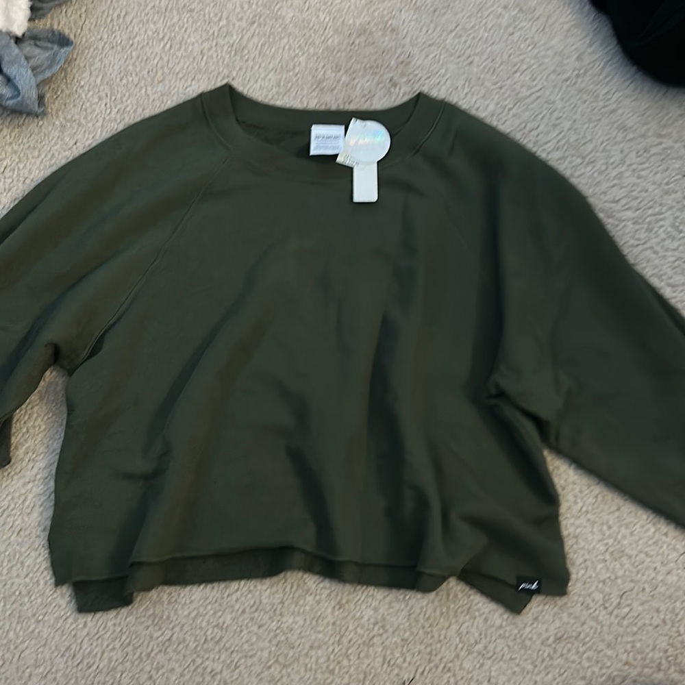a cropped sweatshirt with shorter sleeves